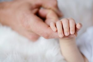 baby-holding-it-s-parent-finger-733880