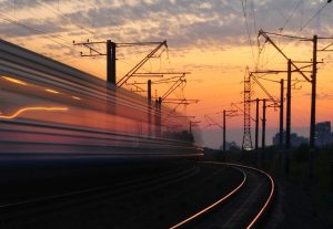 rail-road-under-gray-and-orange-cloudy-sky-during-sunset-163856